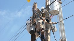 NV Energy crews in southern Nevada use a trusty chain saw to carefully remove a portion of a pole that caught fire after a light rain enabled electricity to arc across an insulator.