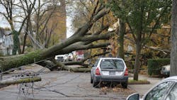 Workers on a doubledeadendangle structure during conductor clipin operations Workers on a doubledeadendangle structure during conductor clipin operations