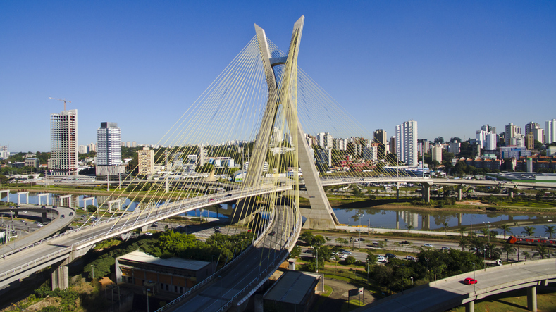 A cityscape with a bridge in the foreground