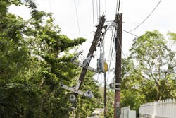 Damaged overhead power lines and pole Damaged overhead power lines and pole