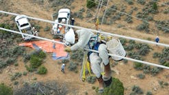 Tri-State G&amp;T lineman Kyle Broyles repairs a gunshot conductor on a 345-kV line in Montrose, Colorado.
