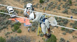 Tri-State G&amp;T lineman Kyle Broyles repairs a gunshot conductor on a 345-kV line in Montrose, Colorado.