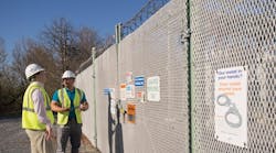 Matt Green (left), director of engineering, and Javier Morales, substation engineering senior engineer, discuss the heightened security measures at one of PPL Electric Utilities substations.