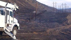BPA equipment is staged to begin the task of repairing firedamaged wooden poles on the ColumbiaValhalla 115kV lines near Wenatchee Wash BPA equipment is staged to begin the task of repairing firedamaged wooden poles on the ColumbiaValhalla 115kV lines near Wenatchee Wash