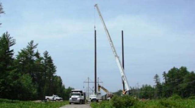 Crews set the final pole for the southern section of the MPRP in a CMP transmission corridor in the town of Wells.