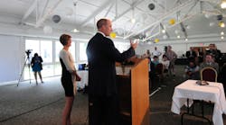 NRG President and CEO David Crane speaking alongside Green Mountain Power President and CEO Mary Powell announcing the new partnership.