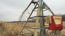In this partially harvested field, a gREX meter is installed at an irrigation pivot Zimmatic control panel.