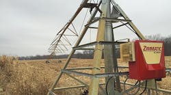 In this partially harvested field, a gREX meter is installed at an irrigation pivot Zimmatic control panel.