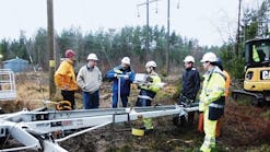 A P&ouml;yry Swedpower/Vattenfall/USi team performs on-site assembly of the weather station.