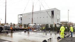 The first energy storage system being lifted into place at a Snohomish PUD substation in South Everett, Wash.