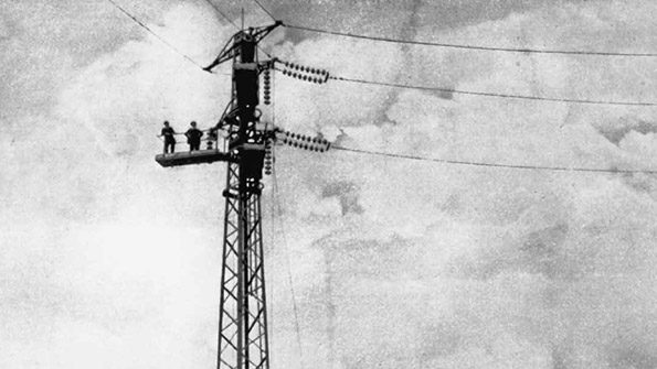 Black and white photo of early electrical power supply workers
