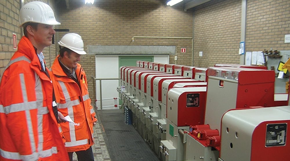 Stedin operators inspect the 13-kV minimum oil circuit breakers in the 50/13-kV Ridderkerk substation prior to replacement.