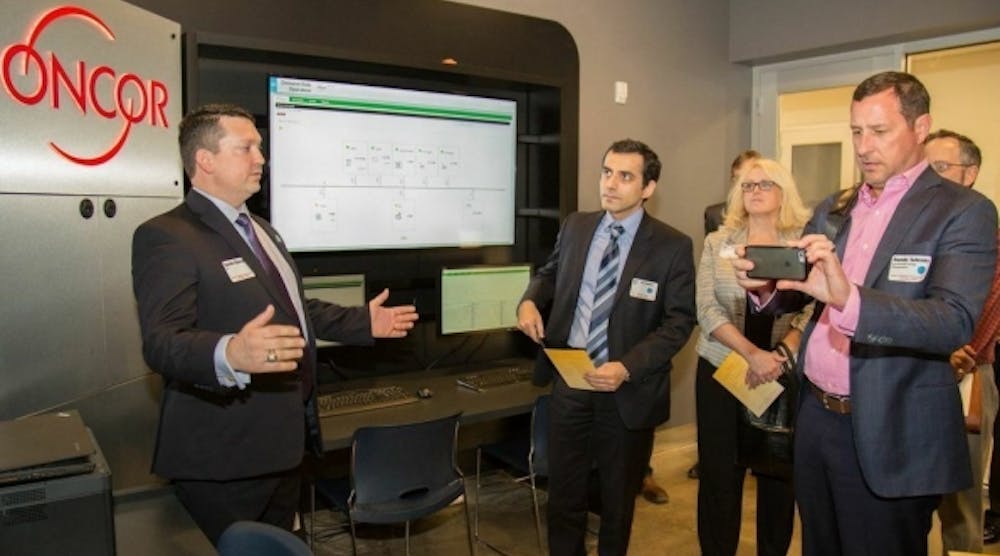 David Chiesa of S&amp;C Electric Company gives a tour of the microgrid control room during Oncor&apos;s ribbon cutting ceremony.