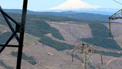 A BPA line maintenance crew makes an urgent repair with helicopter support in a rugged setting near Mount Hood A BPA line maintenance crew makes an urgent repair with helicopter support in a rugged setting near Mount Hood