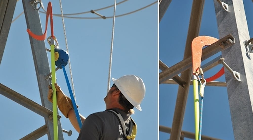 Upper Great Plains lineman Shayne Bender demonstrates how to use a buck hook with a self-retracting lanyard to ascend a steel lattice tower at fall protection training in Mead substation.