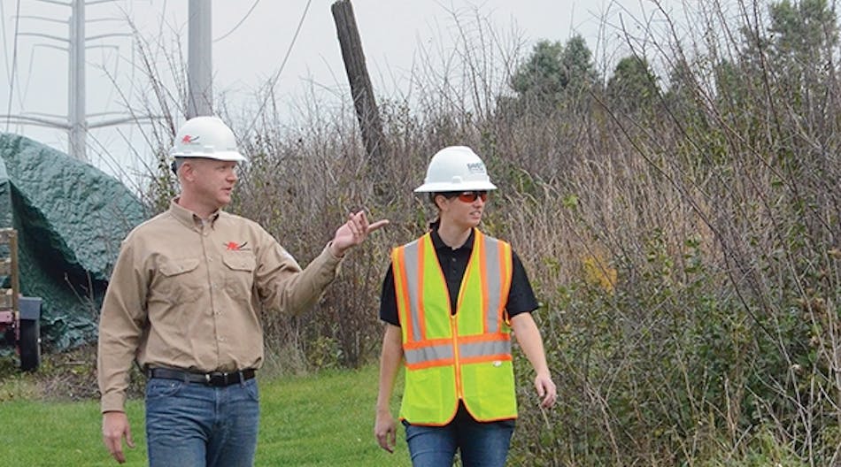 ATC&rsquo;s Ben Gura walks a right-of-way with Davey Resource Group&rsquo;s Katie Canfield to evaluate the effects of prior IVM techniques and to plan for the next phase.