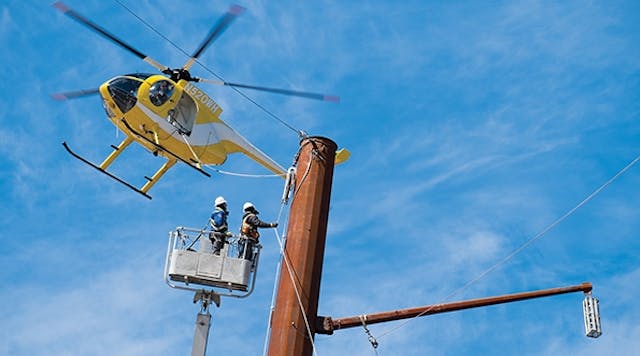 A helicopter provides aerial assistance as a PPL Electric Utilities crew makes final preparations on the Susquehanna&ndash;Roseland transmission line.