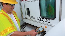 Clyde Kunimura, a senior service lineman with Hawaii Electric Light Co., uses the Zonar Electronic Vehicle Inspection Reporting (EVIR) system during an inspection of his utility&rsquo;s truck. The system has proven to be an effective tool that holds drivers accountable by keeping track of when they did their inspections and how long it took them.