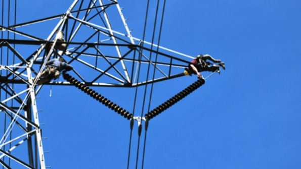 Installing sensor at the top of insulator Photo courtesy of EPRI