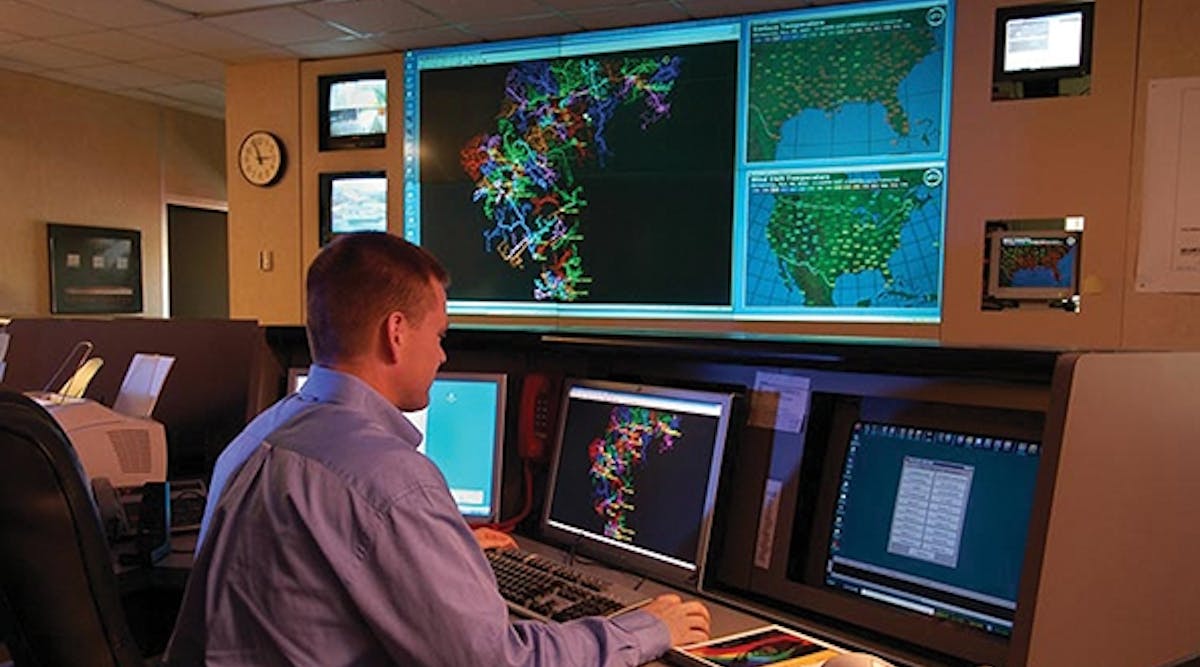 A Blue Ridge Electric system operator monitors an outage map.