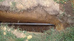 The boring pipe is visible beneath the ground in this section that was first excavated to remove rock The boring pipe is visible beneath the ground in this section that was first excavated to remove rock