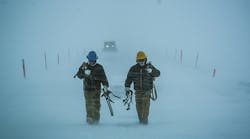 Two linemen from Barrow Utility Electric just finished climbing a pole in -27&deg;F weather in Barrow, Alaska.