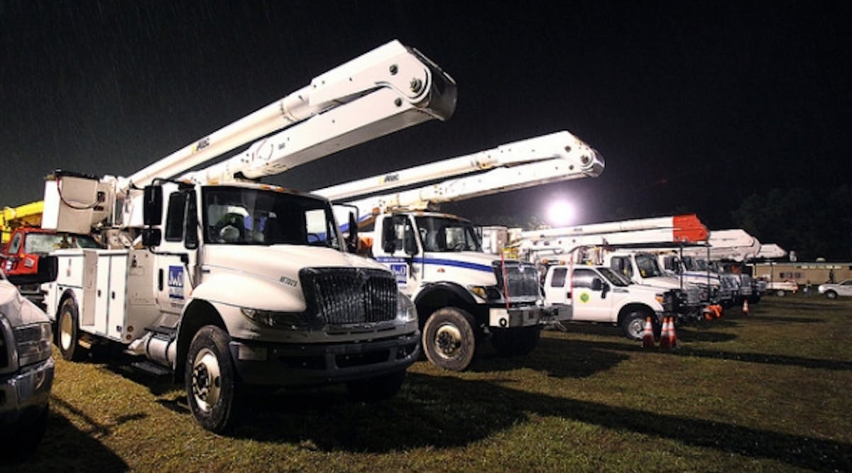 Power Company Crews from Ohio stage at Miller Airfield in Bayville, New Jersey on the evening of Friday October 2, 2015. The crews will assist JCP&amp;L in storm preparations and repairs throughout the JCP&amp;L service area.