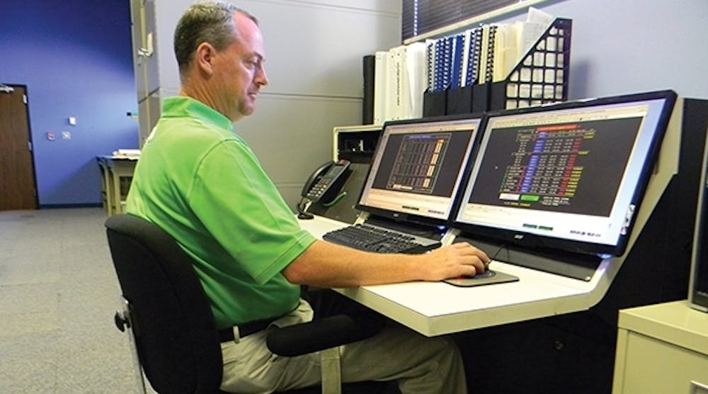 A Pee Dee Electric load control team member illustrates how the system voltage can be monitored and adjusted from the SCADA workstation as well as with an iPad.