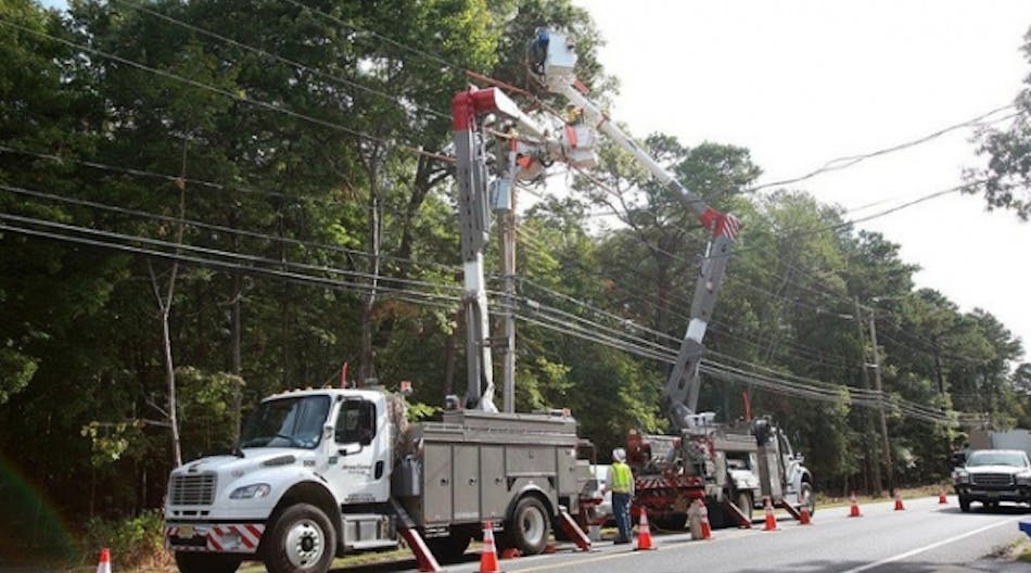 JCP&amp;L crews installing crossarms earlier this year.