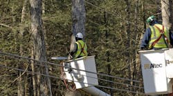 Crews trim limbs and trees away from electric lines on Rt. 4 in Sharon, Connecticut.