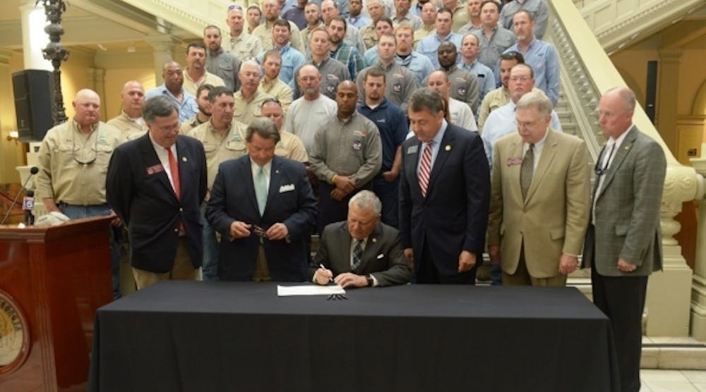 Governor Nathan Deal marks Lineman Appreciation Month by signing House Bill 767 into law Tuesday. The legislation adds utility vehicles and workers to an existing law which requires drivers to &apos;move over&apos; one lane.