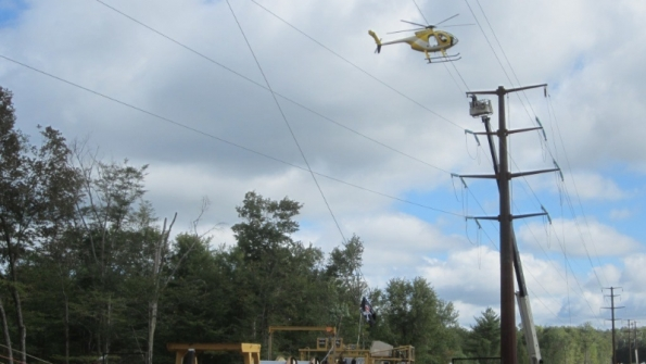 A helicopter helps string new wires over a portion of the NortheastPocono Reliability Project