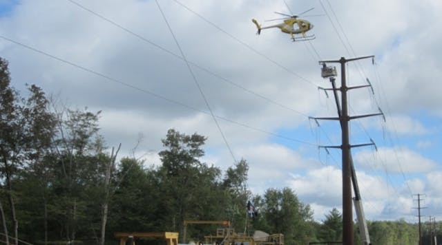 A helicopter helps string new wires over a portion of the Northeast-Pocono Reliability Project.