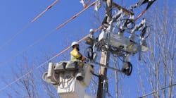 A PPL Electric Utilities line worker installs a smart grid switch in their Pennsylvania service territory. The company recently implemented the technology, which enables automated power restoration in minutes.