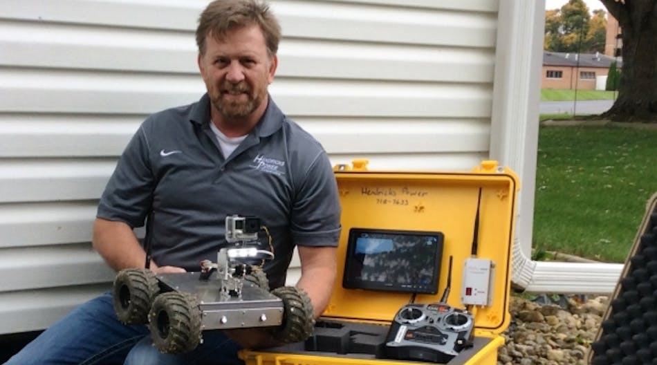 Hendricks Power&rsquo;s Steve Hite now uses a custom-made robot to take the grunge out of crawl space inspections during energy audits. (Photo courtesy of Hendricks Power)