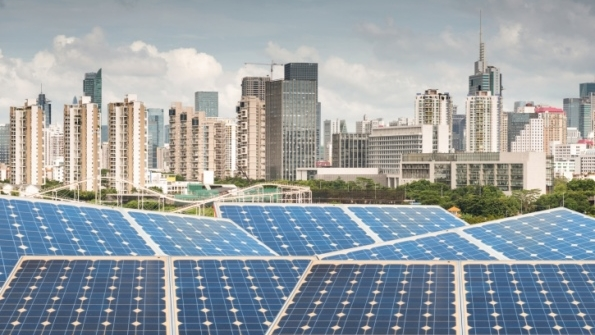 solar panels in front of city