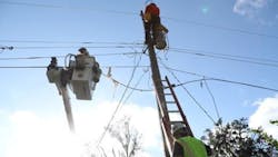 Met Ed linemen working on power line Met Ed linemen working on power line