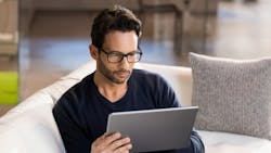 man looking at tablet man looking at tablet