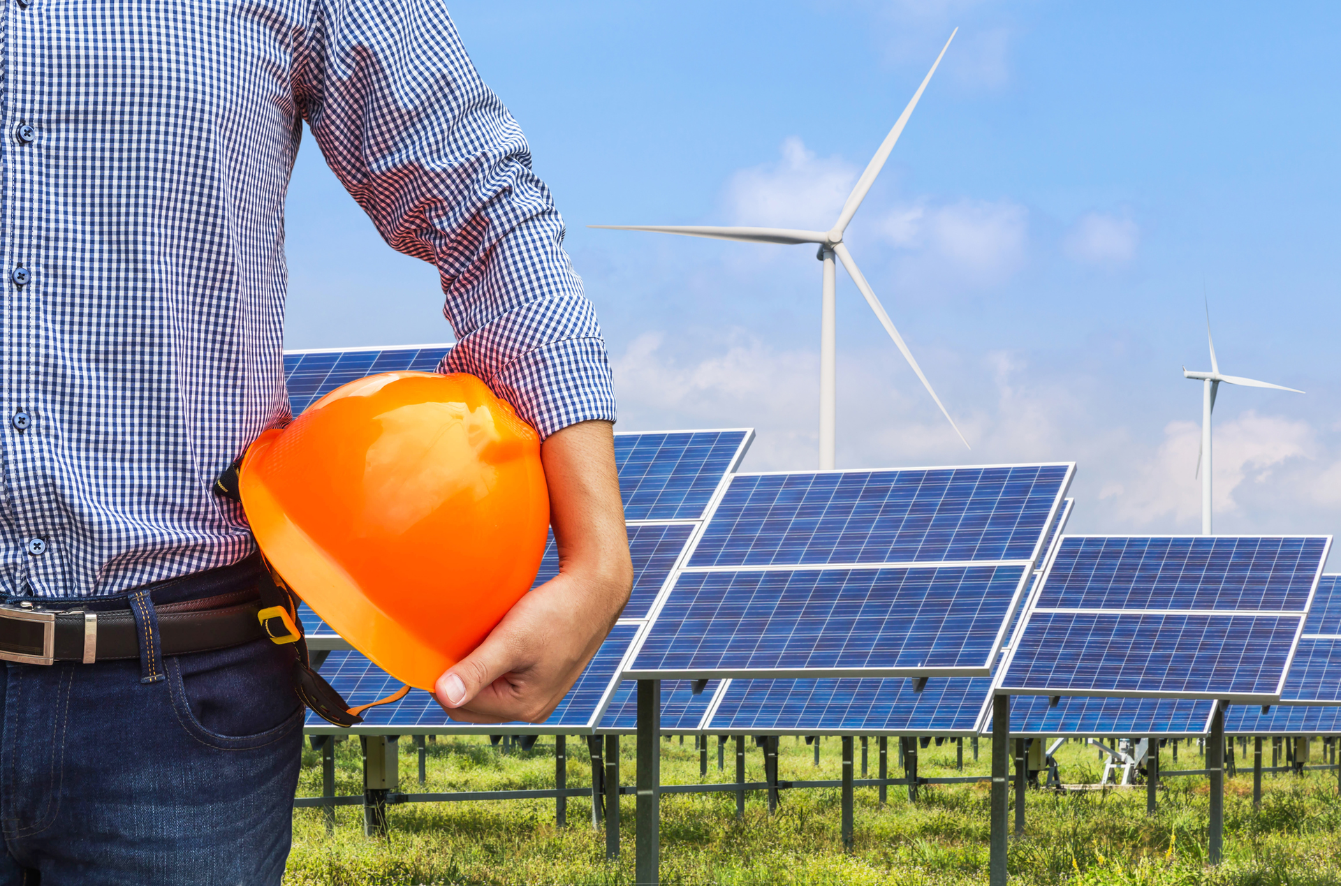 worker by solar panels
