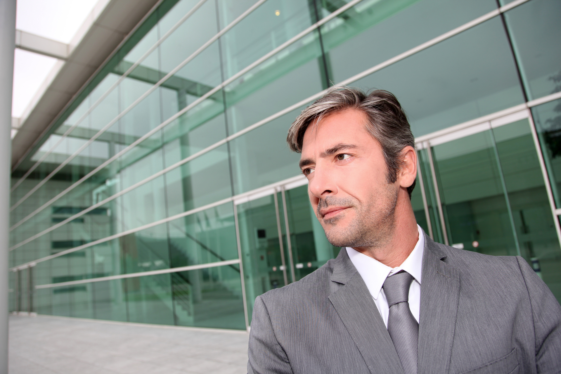 businessman in front of building