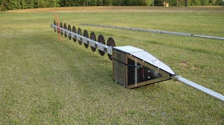 The aerial saw consists of ten 2-ft-diameter blades that are attached to a 90-ft aluminum boom. A series of belts turn the blades at 4,000 rpm.
