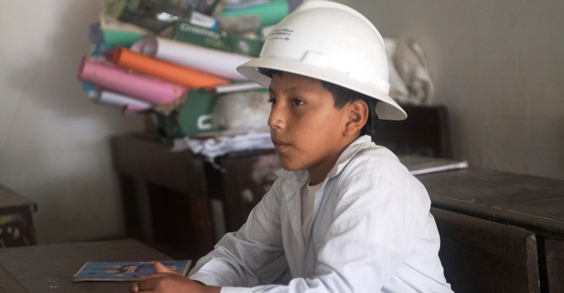 student in Bolivia with hardhat