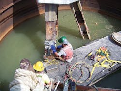 A crews installs the upper shear clips required for pier addition.