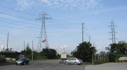 Congestion caused construction problems because the 115-kV line being upgraded crosses under a 230-kV line and above a distribution line.