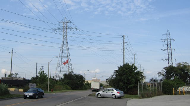 Congestion caused construction problems because the 115-kV line being upgraded crosses under a 230-kV line and above a distribution line.