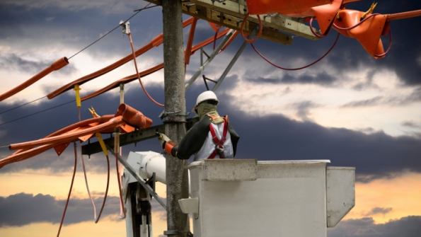 Lineman working on pole