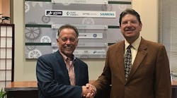 Dr. Mike Mazzola (r), UNC Charlotte EPIC Director, welcomes new Affiliate Member, Rocky Sease, SOS Intl owner and CEO