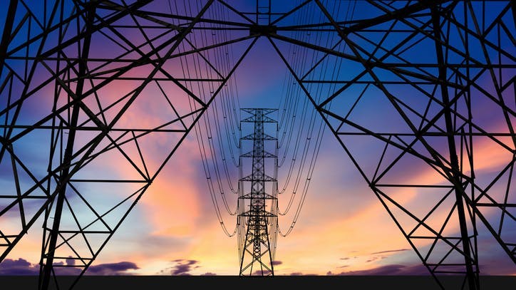 Silhouette image. High voltage tower and Colorful sky.
