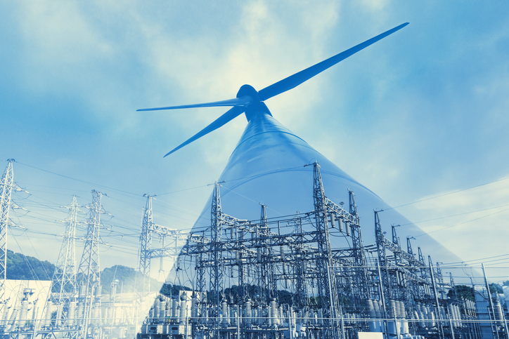 Renewable energy concept. Double exposure of Wind mill and substation.