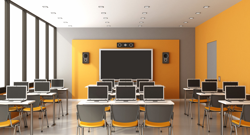 Contemporary multimedia classroom with digital blackboard,laptop and speaker